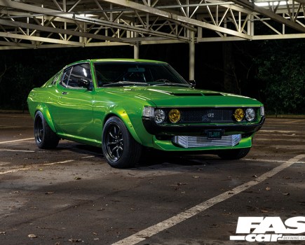 A front right side shot of a green Toyota Celica Mk1
