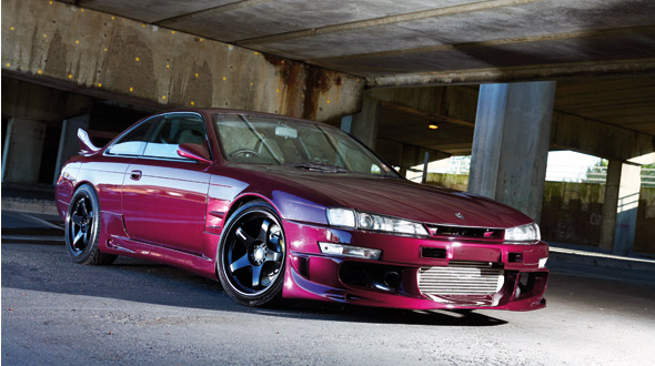 A front right shot of a maroon Nissan S14 200SX