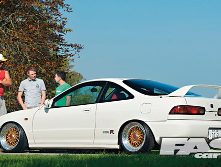 A left side shot of a white Honda Integra on a sunny day