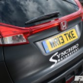 A Synchro Motorsport sticker on the back of a modified Civic Tourer.