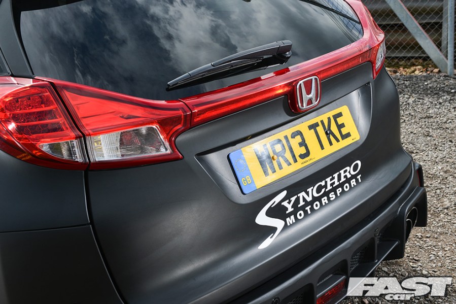 A Synchro Motorsport sticker on the back of a modified Civic Tourer.