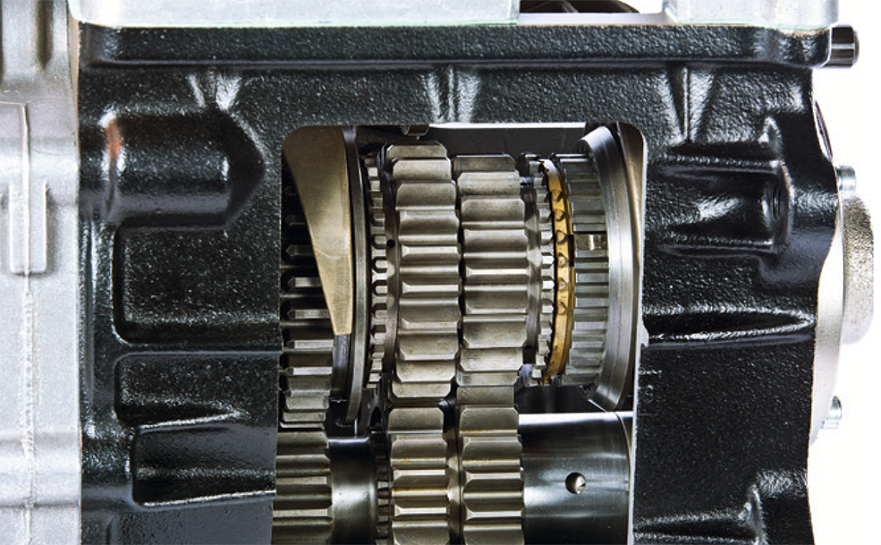 Close up of a black and gold gear box