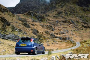A Ford Focus RS driving on a rural road.