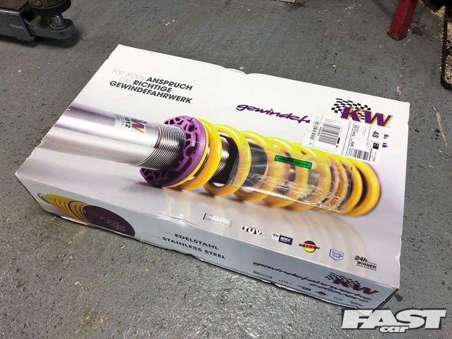 A box containing KW coilovers.