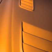 A close up of the vents on an orange Lexus Soarer Z30