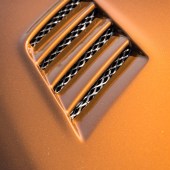 A shot of the vents on the exterior of an orange Lexus Soarer Z30
