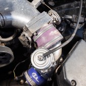 A close up of an engine pipe inside a Lexus Soarer Z30
