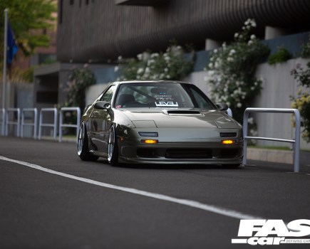 Front left angled view of a murky green tuned Mazda RX 7 FC Japana