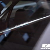 Close up shot of metal poles in the back of a Mazda RX 7 FC Japana