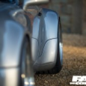 Low shot down the side of a Porsche 964
