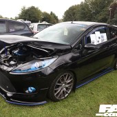 Black car with bright blue details at the Forge Action Day 2019