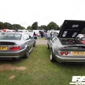 Rear view of two grey cars, one with an open boot at the Forge Action Day 2019