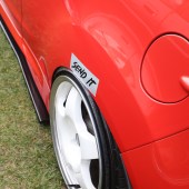 Send it' sticker above the wheel of a red car at the Forge Action Day 2019