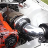 Close up of a silver and orange engine at the Forge Action Day 2019