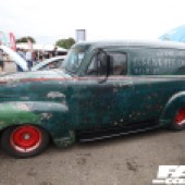 Left side of a worn green Chevrolet 3100 at the Forge Action Day 2019