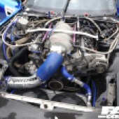 Blue, silver and black engine of a Mazda RX7 at the Forge Action Day 2019