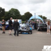 A group of people admiring a modified Mazda RX7 at the Forge Action Day 2019