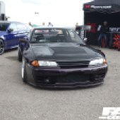 Black Nissan Skyline in front of the Pipercross stall at the Forge Action Day 2019