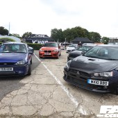 Blue Ford and a black Mitsubishi in a cluster of cars at the Forge Action Day 2019
