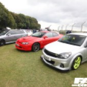 A silver and green Vauxhall Astra next to a red Holden Monaro at the Forge Action Day 2019
