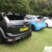 A row of black blue and white Ford Focus RS at the Forge Action Day 2019