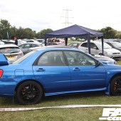 Right side of a bright blue Subaru Impreza WRX at the Forge Action Day 2019