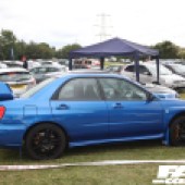 Right side of a bright blue Subaru Impreza WRX at the Forge Action Day 2019
