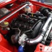 The engine of a red Audi Coupe GT at the Forge Action Day 2019