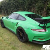 Rear left side shot of a bright green Porsche 911 GT3 at the Forge Action Day 2019