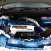 Blue flame patterned engine of a white VW Golf MK7 at the Forge Action Day 2019