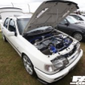 A white Ford Sierra with an open boot and bonnet at the Forge Action Day 2019