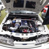 The blue red and silver engine of a white Ford Sierra at the Forge Action Day 2019