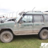 Left side of a mud covered Isuzu Trooper at the Forge Action Day 2019