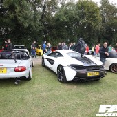 A row of three white cards including a McLaren 540C at the Forge Action Day 2019