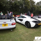 A pale grey Mazda MX5 next to a white McLaren 540C at the Forge Action Day 2019