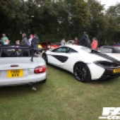 A pale grey Mazda MX5 next to a white McLaren 540C at the Forge Action Day 2019