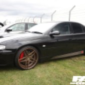 Left side of a black Holden Monaro with bronze alloys at the Forge Action Day 2019