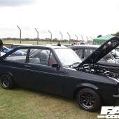 right side of a black Ford Escort with an open bonnet at the Forge Action Day 2019