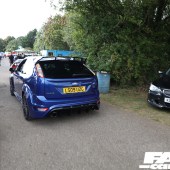 A blue Ford Focus RS with a spoiler driving at the Forge Action Day 2019