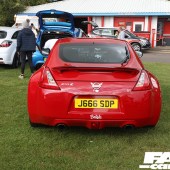 A red Nissan 370Z with a devil horns sticker at the Forge Action Day 2019