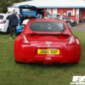 A red Nissan 370Z with a devil horns sticker at the Forge Action Day 2019