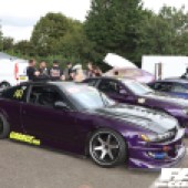 A purple Nissan 180SX with neon stickers at the Forge Action Day 2019