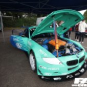 Front right shot of a mint green BMW Z4 GT3 with the bonnet open at the Forge Action Day 2019