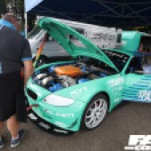 Mint green BMW Z4 GT3 with the left door and bonnet open mint green BMW Z4 GT3 at the Forge Action Day 2019