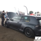 The left side of a matte black VW Golf R with the bonnet open at the Forge Action Day 2019