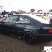 Left side of a black BMW E46M3 with a spoiler at the Forge Action Day 2019