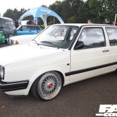 Left side view of a white VW Golf Mk2 with unique alloys at the Forge Action Day 2019
