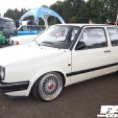 Left side view of a white VW Golf Mk2 with unique alloys at the Forge Action Day 2019