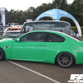 Left side view of a bright green BMW M3 GT2 with a spoiler at the Forge Action Day 2019