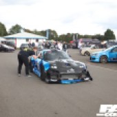Front right shot of a blue and black Mazda RX 7 at the Forge Action Day 2019